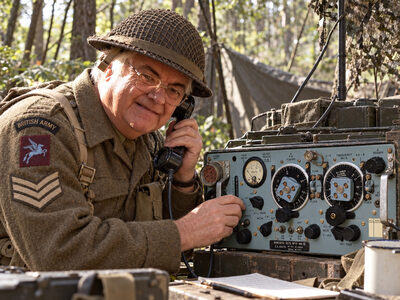 Ray in Second World War army uniform operating a Wireless Set No 19 Mk III